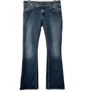*defect in hem 31/33 Silver AIKO Slim Boot jeans. Western Glove Works.